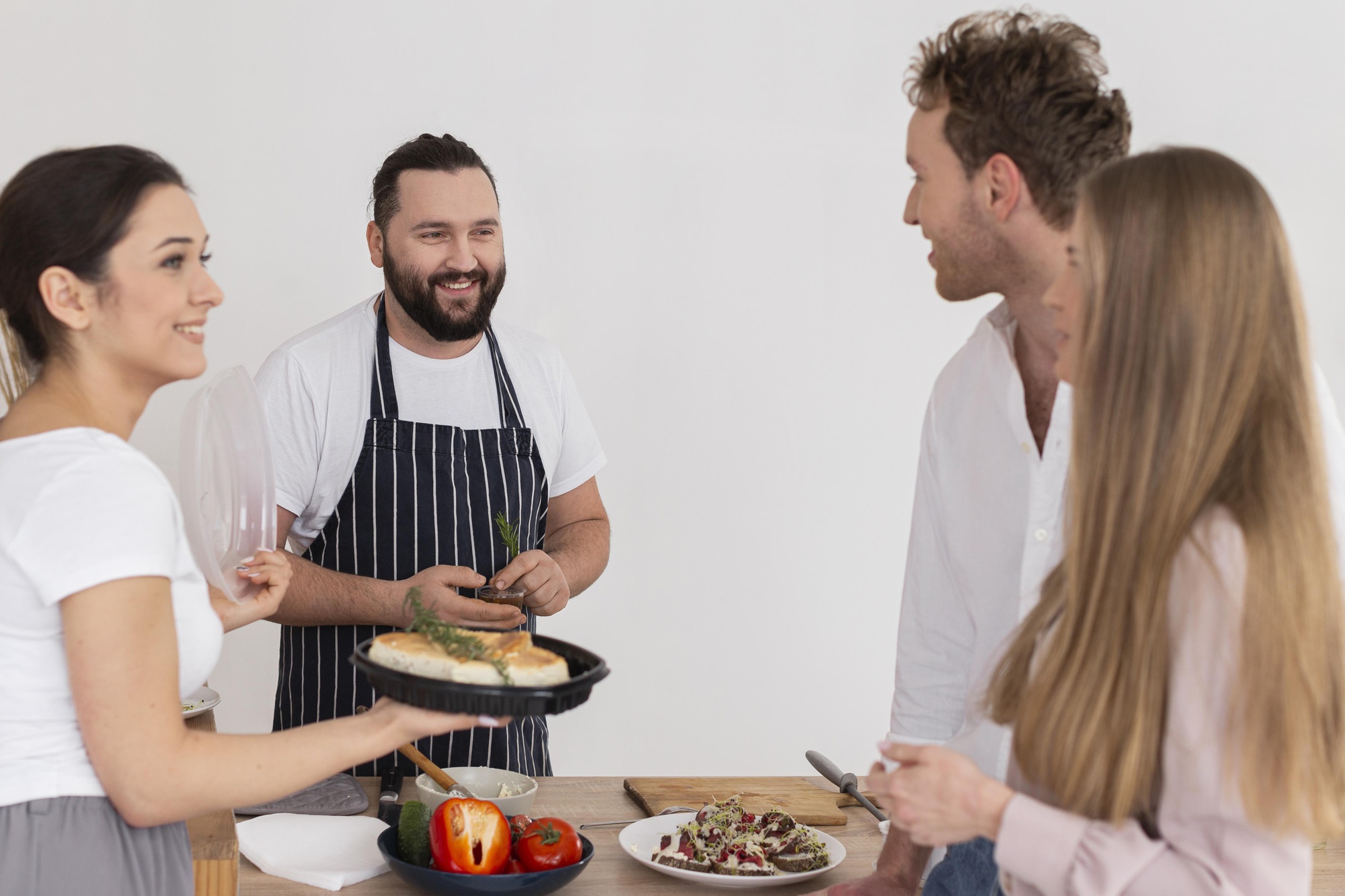 Instructor speaking to small cooking class